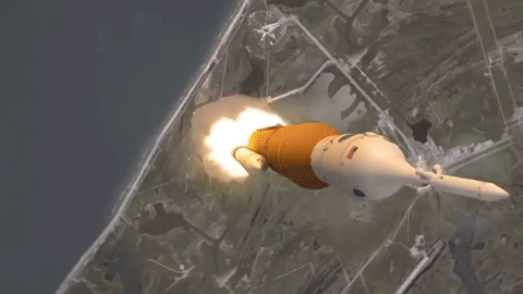 2/5/26 10:58PM VISION: WHITE ROCKET WITH A BLACK ARRAY IN IT, ROCKET WAS LAYING DOWN, THEN IT WAS STANDING STRAIGHT UP, UPPER THIRD OF THE ROCKET HAS A GIANT SAFETY PIN STICKING THROUGH IT,